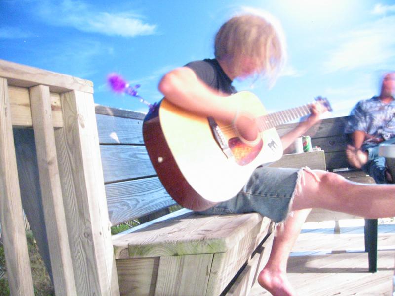 John Ryan playing Guitar